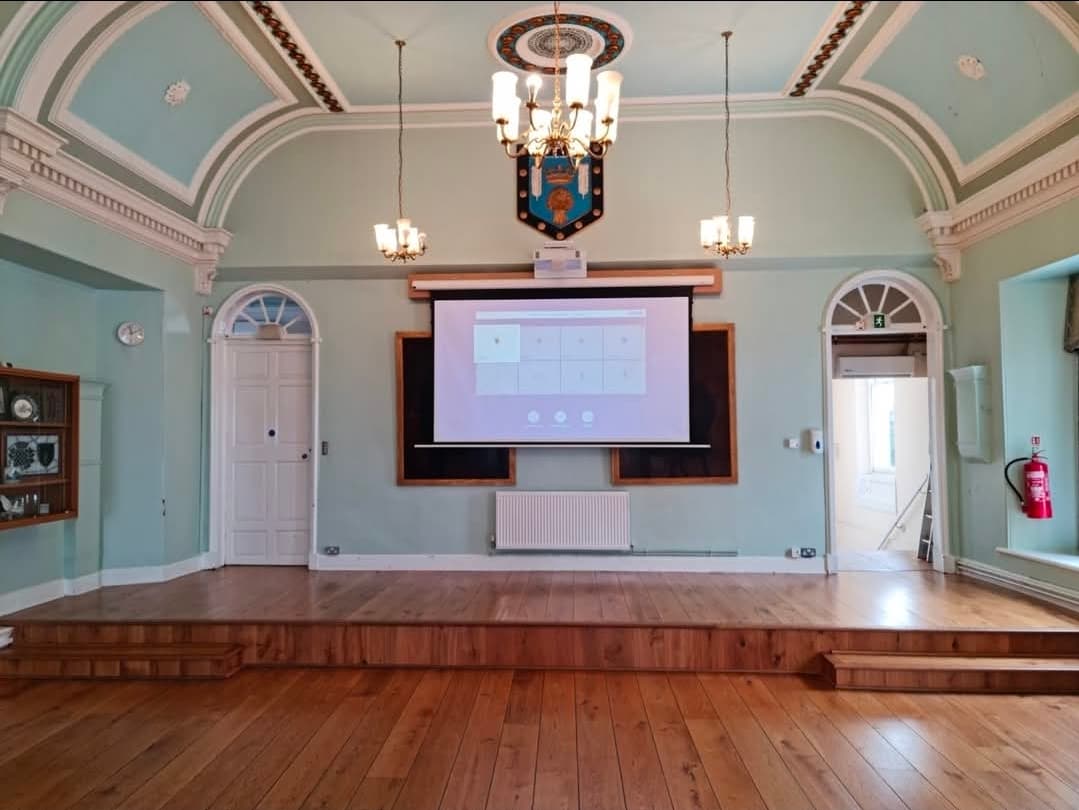 The raised stage beneath the town crest